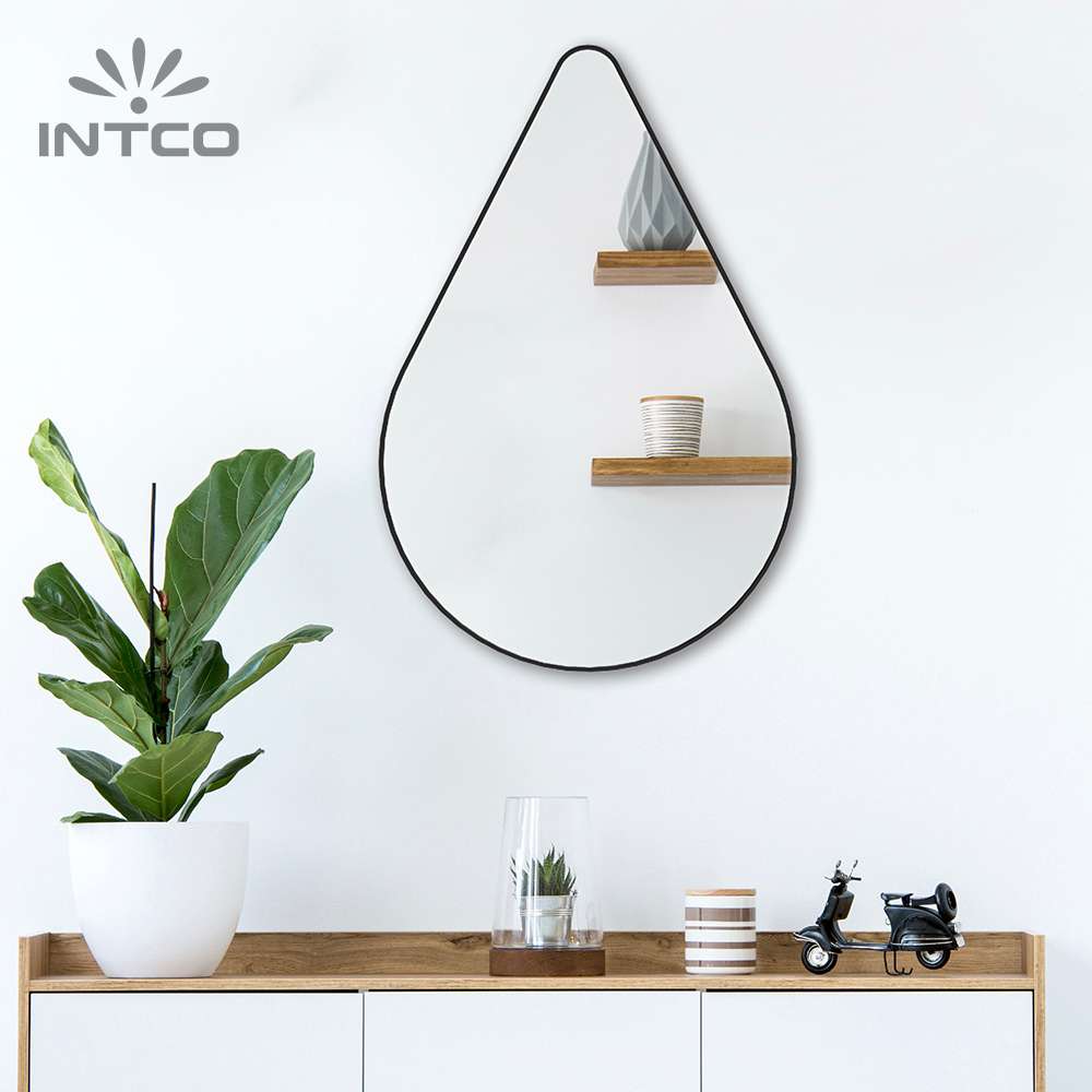Add a touch of playful glamour to your space with Intco water drop metal frame wall mirror